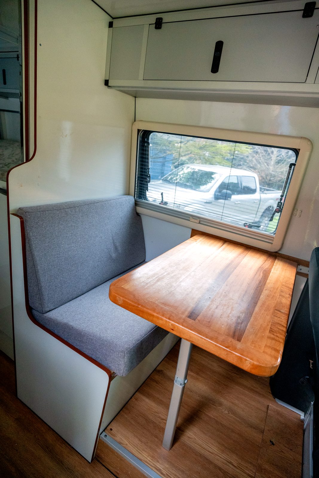 Interior dinette with bench seat and fold-out table