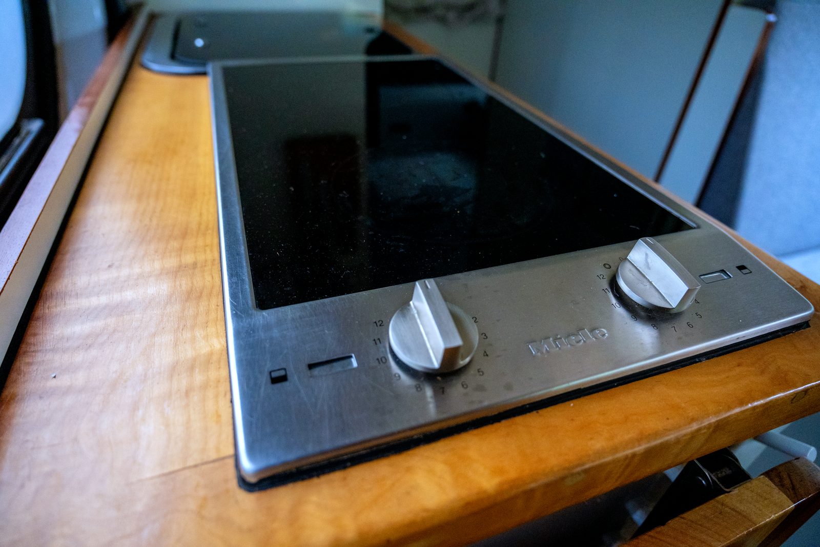 Close-up of the two-burner induction cooktop on the wood countertop
